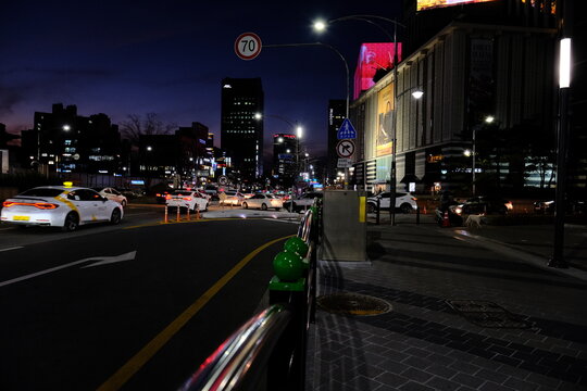 A picture of a late night street in the city.