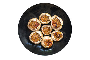 mushroom stuffed meat mushrooms baked fresh pork, beef, chicken or turkey meal snack on the table copy space food background rustic keto or paleo diet 