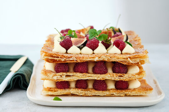 Milfey. dessert of puff pastry, vanilla cream and raspberries