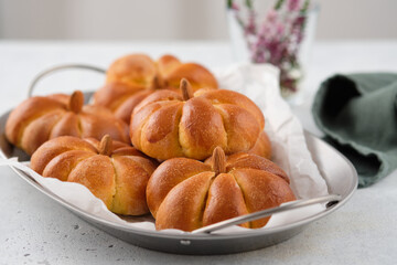 Pumpkin buns bread on grey background. Halloween Food Concept. Autumn concept.