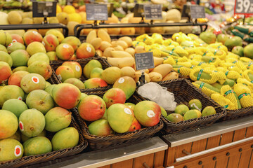 Assortment of fresh fruits on counter in supermarket