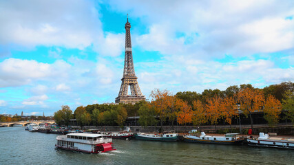 Fototapeta na wymiar Banner of travel in Paris with Eiffel Tower iconic Paris landmark across the River Seine with tourist boat in Autumn tree fall scene at Paris ,France