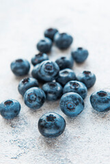 Blueberries on grey concrete background