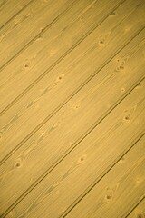 Empty wooden texture backdrop with space for text.  Close-up of brownish surface with vertical lines with space for text.