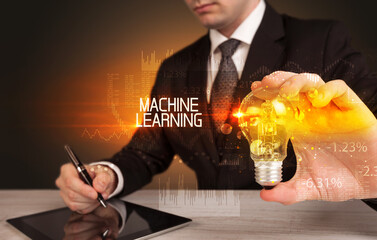 Businessman holding a lightbulb concept