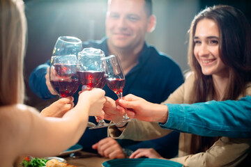 Party at a restaurant. Friends have fun in a restaurant and drink wine. festive mood.