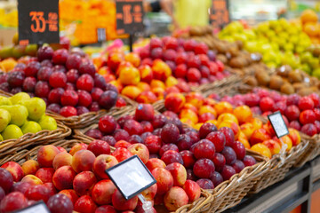 Assortment of fresh fruits on counter in supermarket