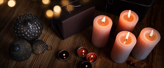 Christmas decoration on old wood
Christmas gifts decorated with candles and atmospheric bokeh on...