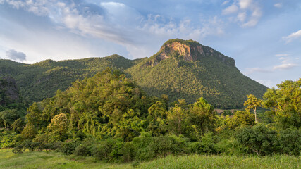 Early evening landscape with trees and karst mountain in rural countryside, Chiang Dao, Chiang Mai, Thailand