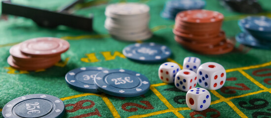 Gambling board game.Cards, chips, roulette.Gaming flat lay. Close-up of a card for playing poker on a gaming table in a casino against a background of chips. Background for the gaming business.