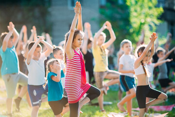 Yoga classes outside on the open air. Kids Yoga,