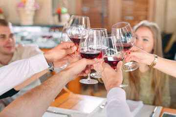 Close-up Of Friends Toasting Wineglasses At Party