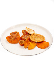dried fly agaric mushroom on a plate on a white background