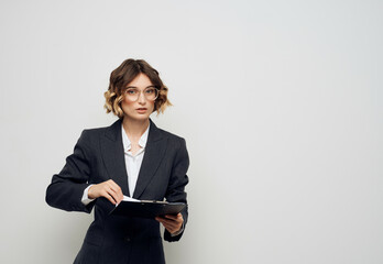 Businesswoman documents in hand executive office