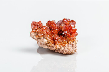 Macro mineral stone Vanadinite on a white background