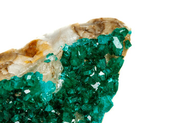 Macro mineral stone Dioptase silicate copper on a white background