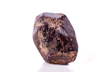 Macro of a mineral garnet stone on a white background