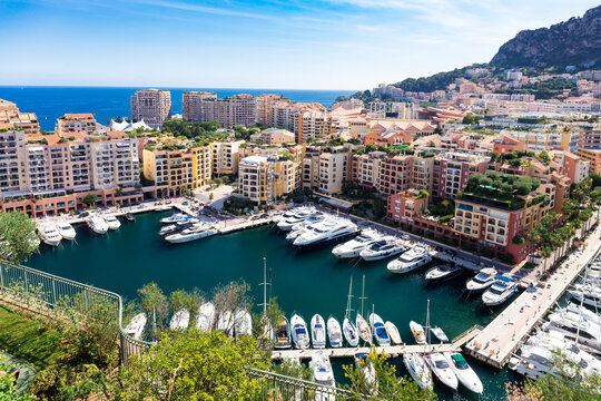 Panoramic aerial view on luxury yachts and apartments of city centre and harbour of Monte Carlo, Cote d'Azur, Monaco, French Riviera.