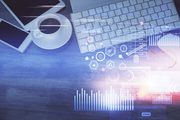 Double exposure of technology theme drawing over work table desktop. Top view. Global data analysis concept.