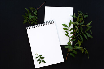 White notebook mockup template on black background with magical mysterious mood.