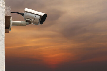 CCTV camera system on twilight sky background.