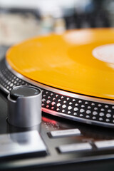 Hi fi turntable and vinyl record. Professional analog dj player in close up. Listen to the music in...