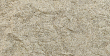 Wrinkled texture of brown paper.