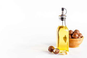 Macadamia essence oil with macadamia nuts. Organic product for food or cosmetic