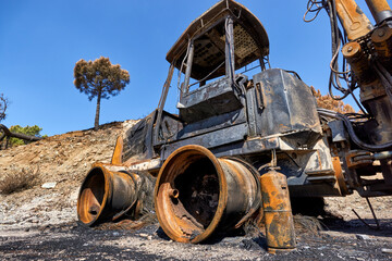 Heavy machinery burned by fire in the Jubrique fire next to Sierra Bermaja in the Genal Valley,...
