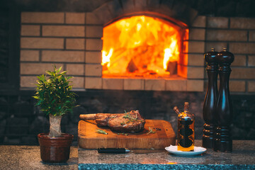 Cooking Steak in a stone oven.