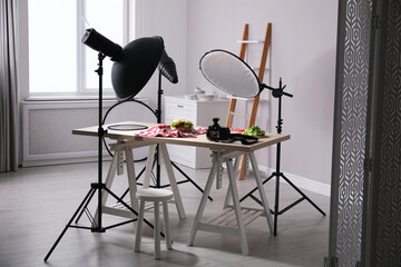 Professional camera and composition with tasty sandwich on table in photo studio. Food photography