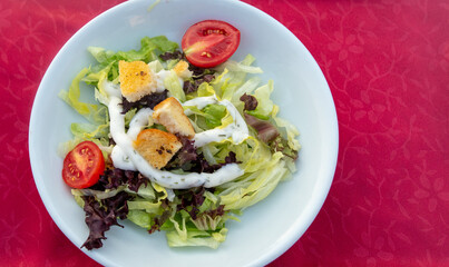 Italian salad on a white plate.