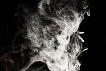 clouds of white smoke on a black background