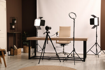 Modern blogger's workplace with professional equipment in room