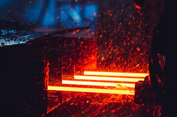 hot steel on conveyor in steel mill