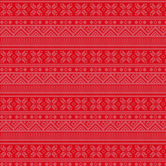 Obraz premium red and white christmas background. seamless knit pattern. Vector design