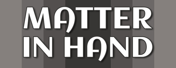 Matter In Hand - text written on grey striped background