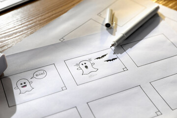 Storyboards with cartoon sketches at workplace. .