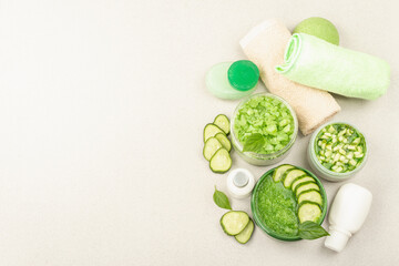 Homemade cosmetics with cucumber. Natural cream, sea salt, body lotion, and soap