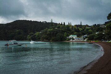 Obraz premium Moody photo of an empty sandy beach on a rainy day.