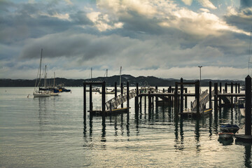 Fototapeta premium Evening of a stormy day at Russel Wharf. Low tide. Retro Style