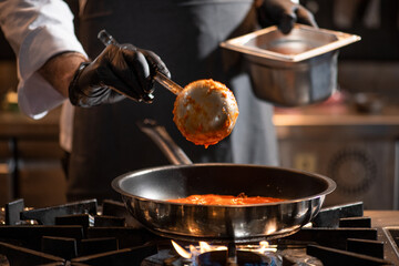 Cropped view of chef cooking Italian pasta with cheese, vegetable