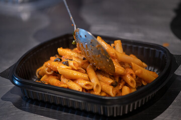Cropped view of chef cooking Italian pasta with cheese, vegetable