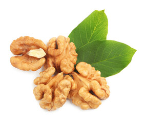 Pile of peeled walnuts and leaves on white background, top view