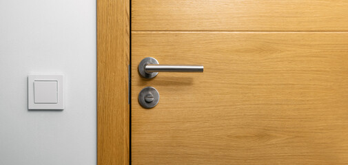 brown wooden door with metal handle. copy space - obrazy, fototapety, plakaty