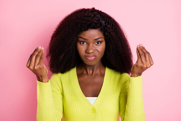 Photo of unsatisfied dark skin lady fingers hands show money symbol sullen face isolated on pink color background