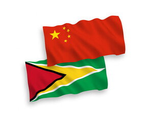 National vector fabric wave flags of Co-operative Republic of Guyana and China isolated on white background 1 to 2 proportion.