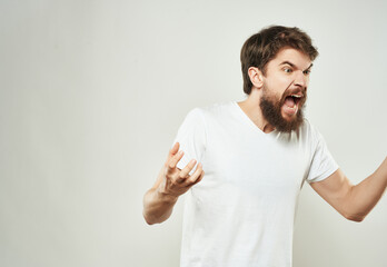 bearded man emotions anger discontent light background