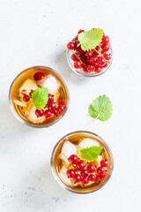 Summer fruit and berry iced tea in glasses. Space fot text, top view.