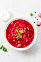 Classic borscht on light background. Top view, copy space.